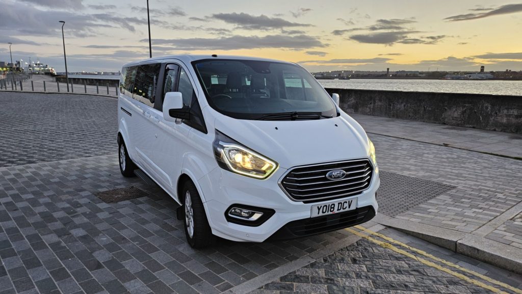 White 8 seater Minibus near Liverpool Docks.